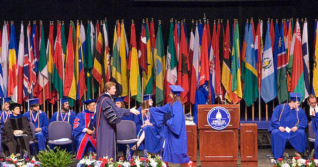 Dr. Kerwin congratulates student at Commencement